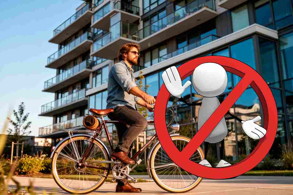 uomo su bicicletta e immagine di omino nel divieto