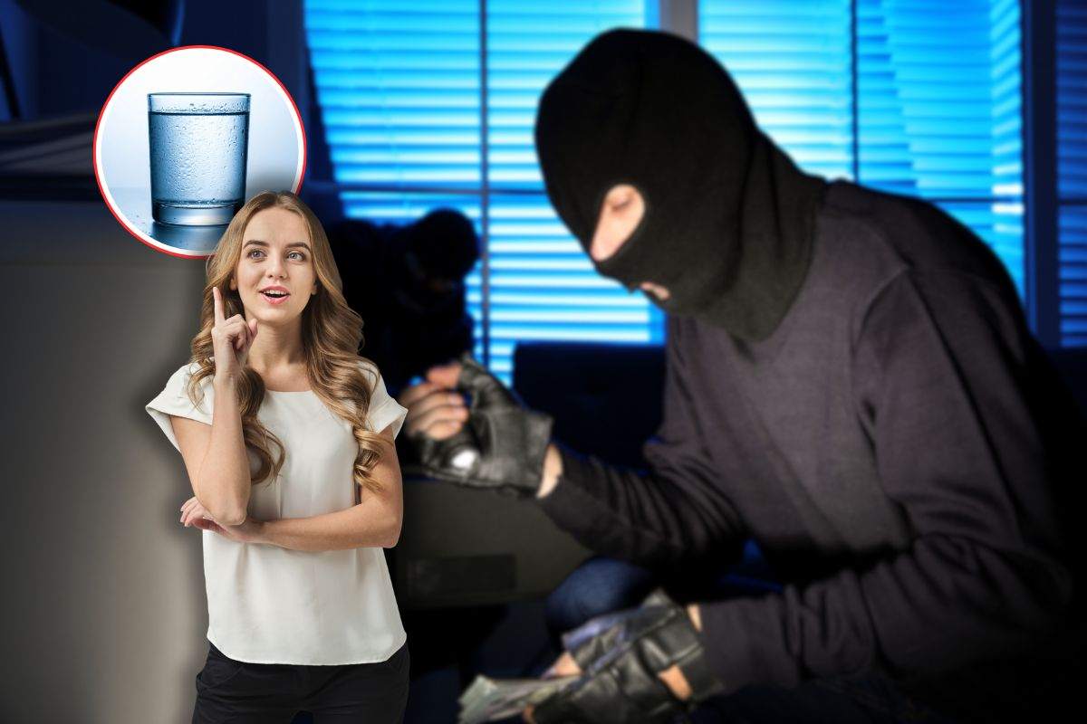 ladri in casa, donna che ha un'idea e bicchiere d'acqua